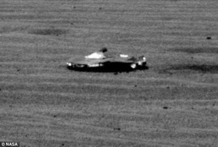Is this the best evidence yet of a UFO on Mars? It's certainly alien, if by alien you mean from Earth, and not Mars. Experts speculate this is a piece of debris from the Curiosity rover's landing capsule. 