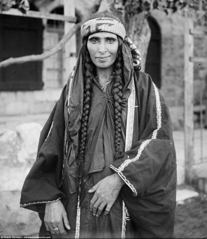 A Bedouin woman in traditional dress. This photo, as well as the others in this series was taken between 1890 and 1914. 