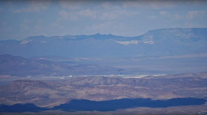 The base is visible in the distance. The images were captured from about 25 miles away. 