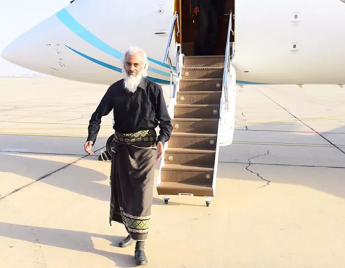 Fr Tom walking off a plane Fr Tom walking off a plane