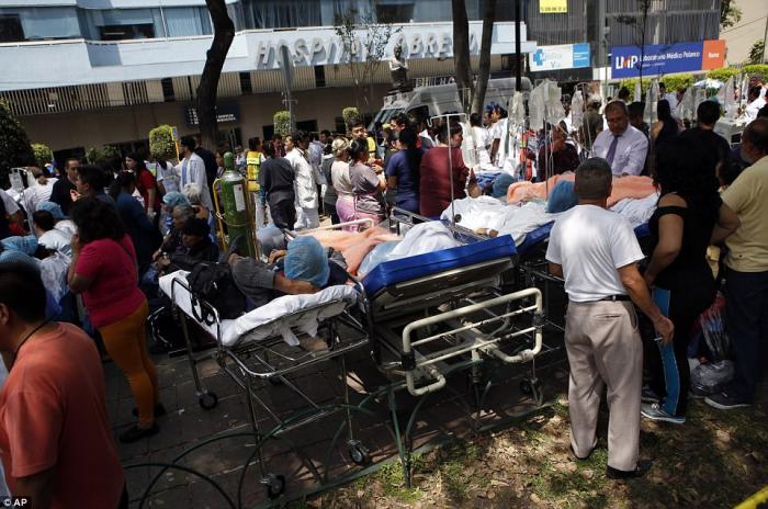 Hospitals evacuated patients to the outdoors and tended to them there as fear of further aftershocks and collapses worried officials. Hospitals evacuated patients to the outdoors and tended to them there as fear of further aftershocks and collapses worried officials.