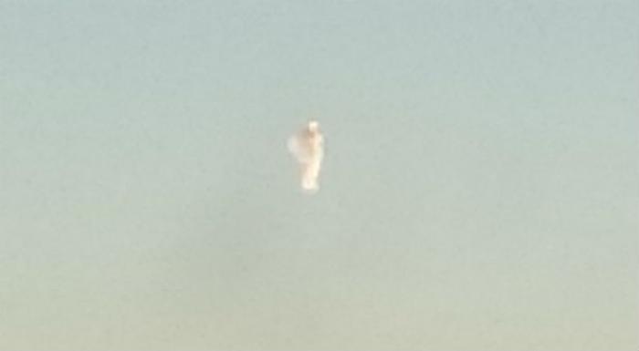 Is this a photo of an angel, or a cloud? Or something else? Is this a photo of an angel, or a cloud? Or something else?