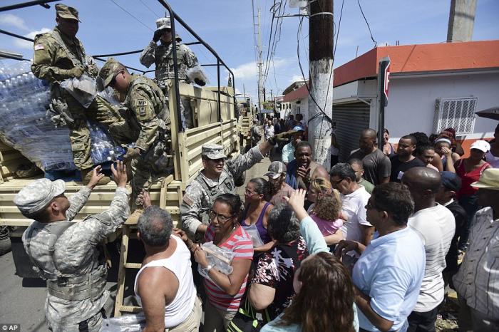 The National Guard has arrived to deliver food and water to the people. The National Guard has arrived to deliver food and water to the people.