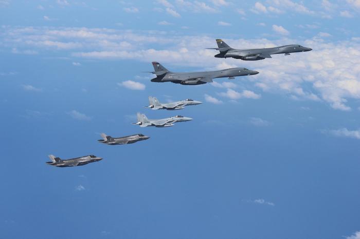 A pair of B1 bombers is escorted by F-15 and F-35 fighters. The F-15 is a dedicated interceptor, and poses a serious threat to anything that approaches. The F-35 is stealthy, and will surprise any enemy that comes near. All aircraft are fast, making them difficult to intercept. 