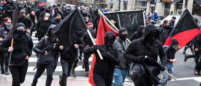 ANTIFA runs riot during a protest. The foot soldiers remain anonymous and have one aim, which is violence. ANTIFA runs riot during a protest. The foot soldiers remain anonymous and have one aim, which is violence.