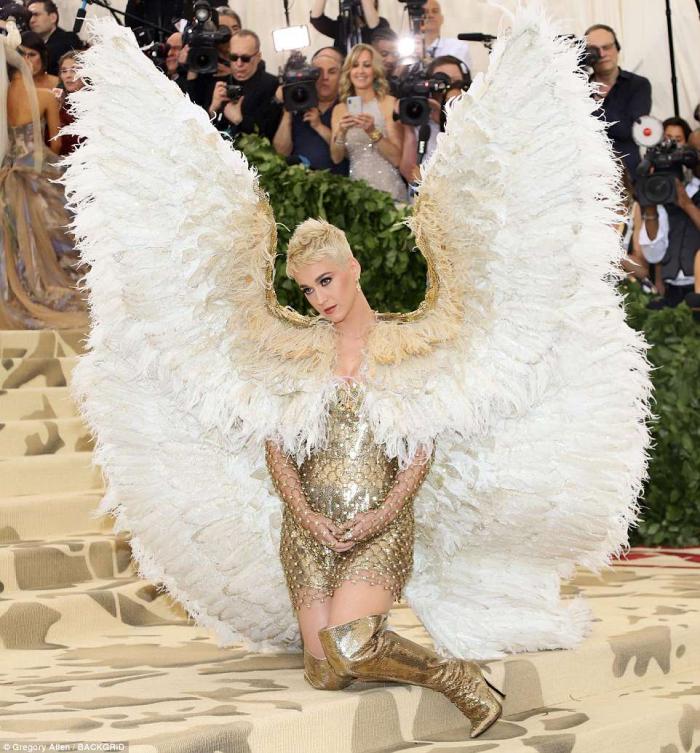 Katy Perry dressed as an angel with giant wings. 