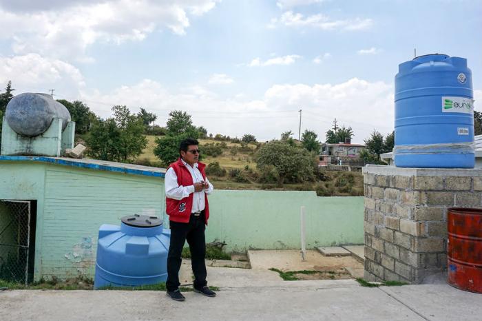 Ernesto Flores Martinez, the school's principal, says access to water would improve if the school paid to tap into a local reservoir. But he's hesitant to pass on yet another cost to parents.