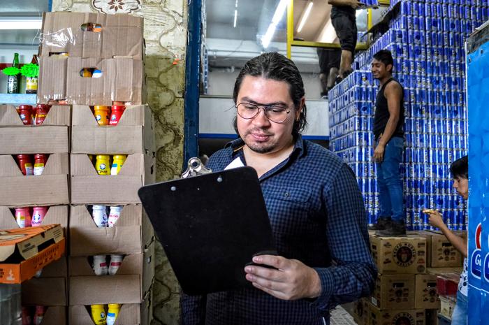 Daniel Alberto Paniagua Flores, 29, who studied audiovisual communication, manages the finances of his familyâ s grocery store in Mexico City, Mexico. He says he had trouble finding work related to his major because of his expectations for pay and time commitment.