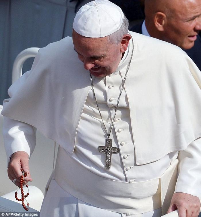 That moment when you're pope, and you catch a rosary --with your ear