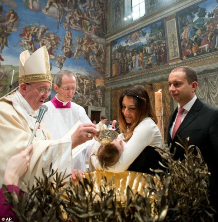 Pope Francis baptized the child of an unmarried couple (not pictured) during a ceremony in the Sisti Pope Francis baptized the child of an unmarried couple (not pictured) during a ceremony in the Sisti