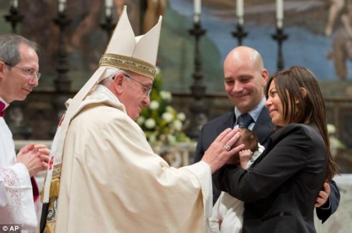 During the mass Pope Francis baptized 32 children in the same room in which he was elected in March During the mass Pope Francis baptized 32 children in the same room in which he was elected in March
