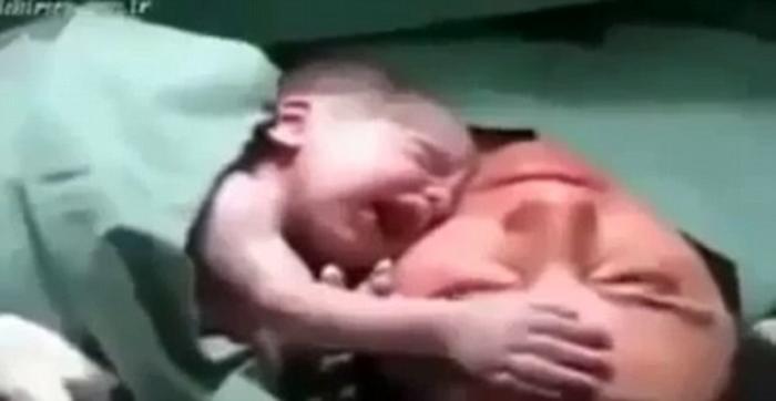 The baby screams as it is removed from mum The baby screams as it is removed from mum