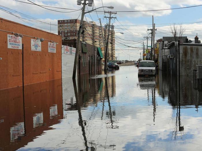 Flood damaged streets in Queens, New York where the historic boardwalk was washed away due to Hurric Flood damaged streets in Queens, New York where the historic boardwalk was washed away due to Hurric