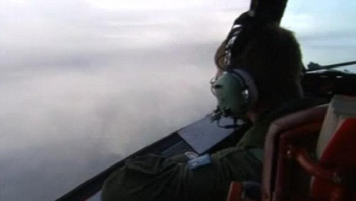 This picture, taken on Thursday morning on board a Royal Australian Air Force Orion plane, shows how This picture, taken on Thursday morning on board a Royal Australian Air Force Orion plane, shows how