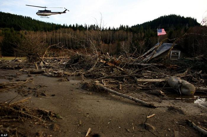 From a helicopter, Snohomish County Sheriff Ty Trenary surveys the wreckage of homes destroyed in Sa From a helicopter, Snohomish County Sheriff Ty Trenary surveys the wreckage of homes destroyed in Sa