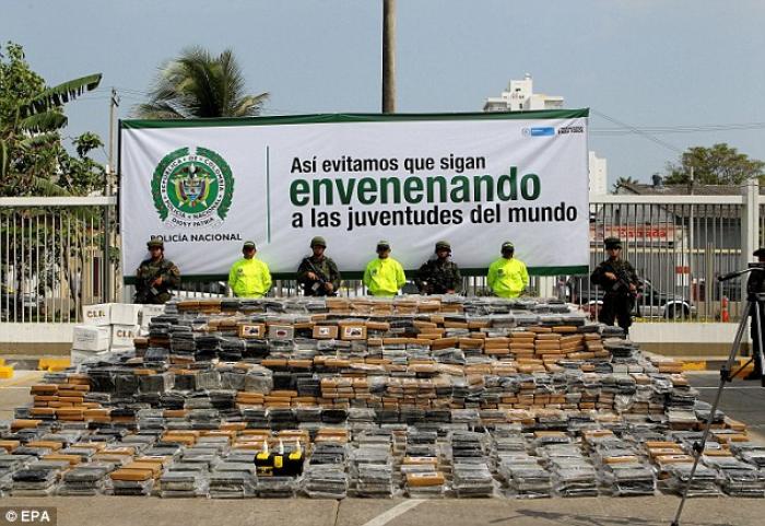 Members of the Colombian National Police present to the media the 7 tons of cocaine confiscated in a Members of the Colombian National Police present to the media the 7 tons of cocaine confiscated in a