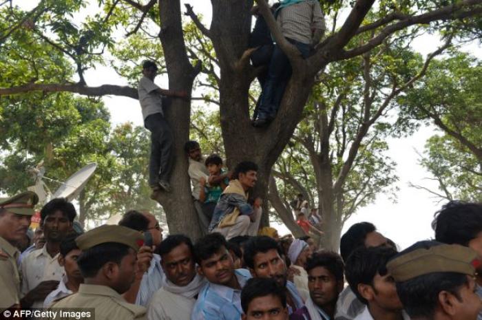 Villagers hold a protest beside the tree where they discovered the dead girls Villagers hold a protest beside the tree where they discovered the dead girls
