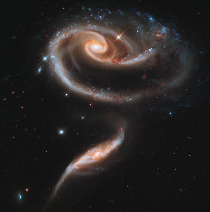 A pair of galaxies known as Arp 273. Observations show the smaller galaxy has collided and passed th A pair of galaxies known as Arp 273. Observations show the smaller galaxy has collided and passed th