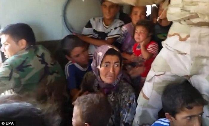 At least 20,000 civilians, most of whom are from the Yazidi community, who had been besieged by jiha At least 20,000 civilians, most of whom are from the Yazidi community, who had been besieged by jiha