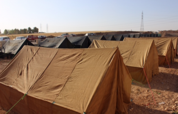 Church grounds in Irbil are dotted with makeshift tents in 105-degree heat. Church grounds in Irbil are dotted with makeshift tents in 105-degree heat.