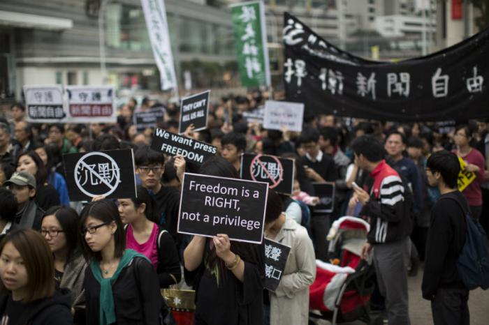 A group of protesters marching against Chinese interference in Hong Kong. A group of protesters marching against Chinese interference in Hong Kong.