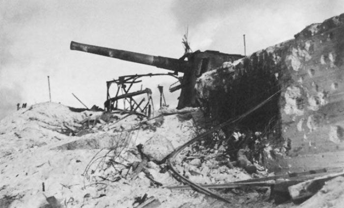 A destroyed Japanese defensive position and coastal gun. A destroyed Japanese defensive position and coastal gun.