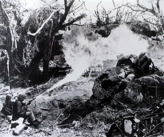 Marines with flamethrowers destroy Japanese positions. Marines with flamethrowers destroy Japanese positions.
