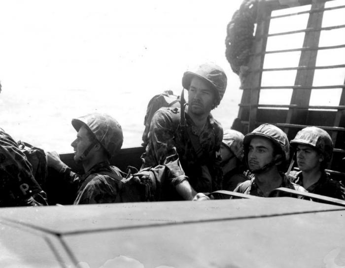 Marines aboard a landing vehicle which will take them ashore. Marines aboard a landing vehicle which will take them ashore.