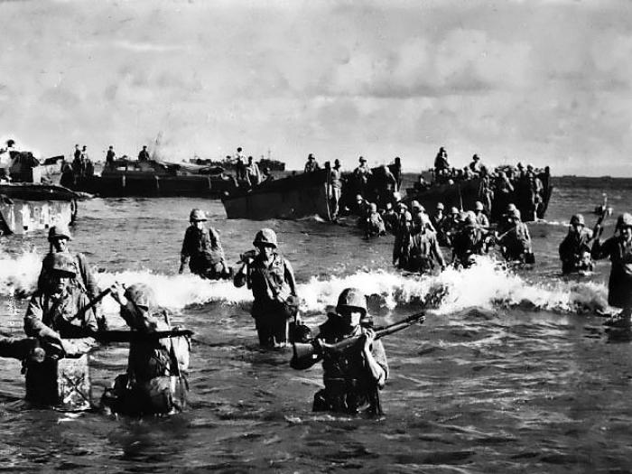 Marines wading ashore through the lagoon. Marines wading ashore through the lagoon.