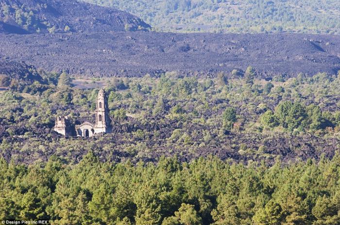 The entire village remains buried, despite the sole structure rising above the vast barren landscape The entire village remains buried, despite the sole structure rising above the vast barren landscape