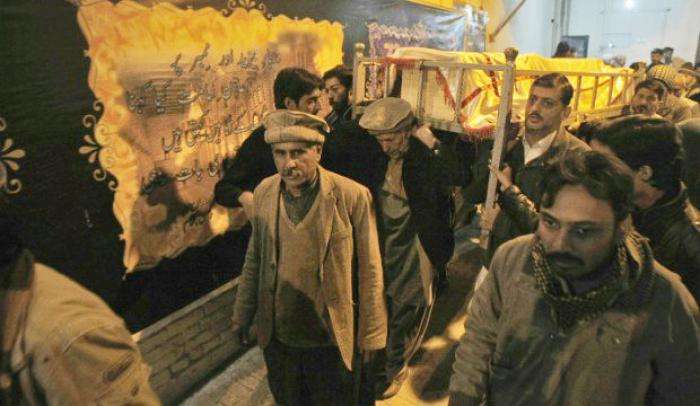 One of the dead is honored in a solemn funeral procession. One of the dead is honored in a solemn funeral procession.