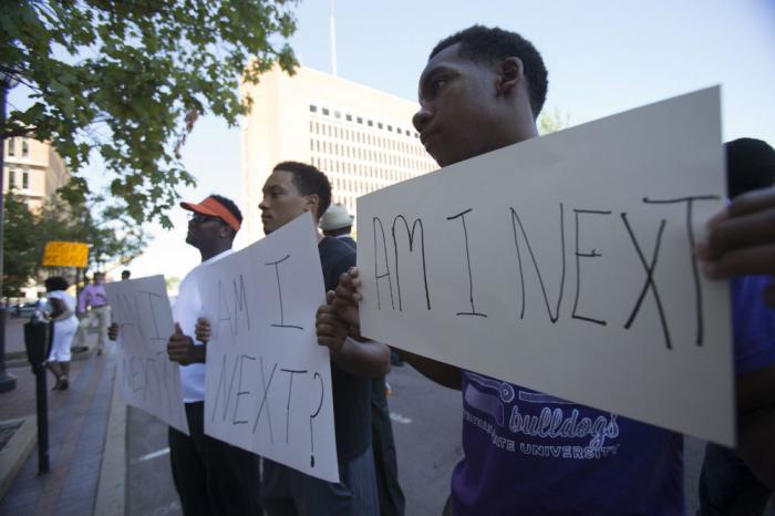 As negative outlooks on racial relations reach a new high, protests surrounding the Ferguson and Sta As negative outlooks on racial relations reach a new high, protests surrounding the Ferguson and Sta