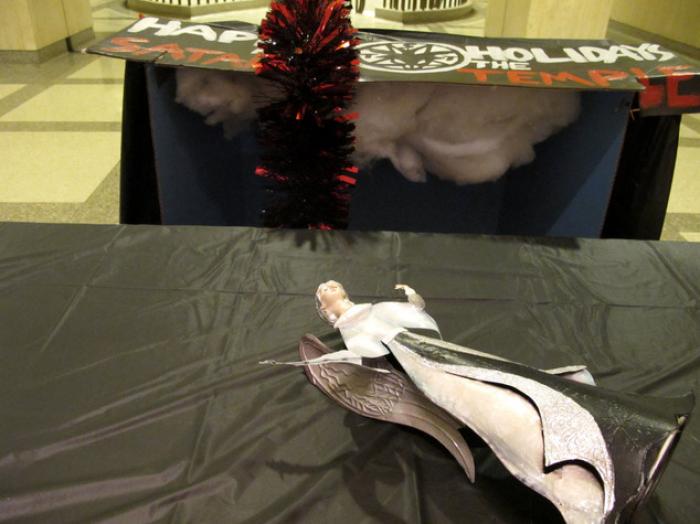 The angel after it had been torn from the Satanic display. The angel after it had been torn from the Satanic display.