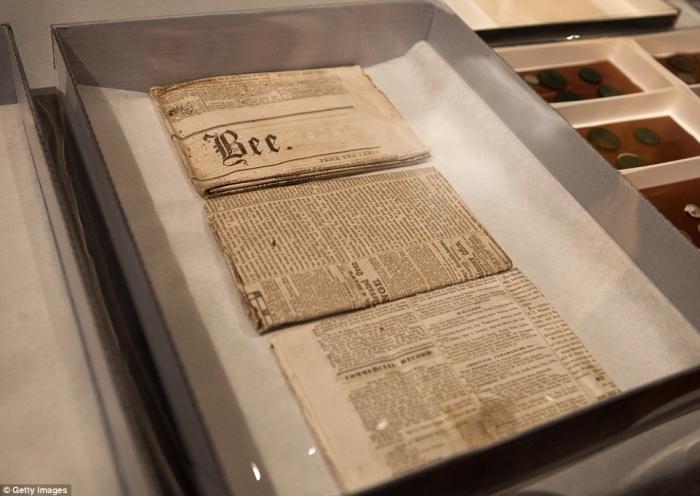 Five folded newspapers were found in the time capsule. They will likely remain folded to preserve th Five folded newspapers were found in the time capsule. They will likely remain folded to preserve th