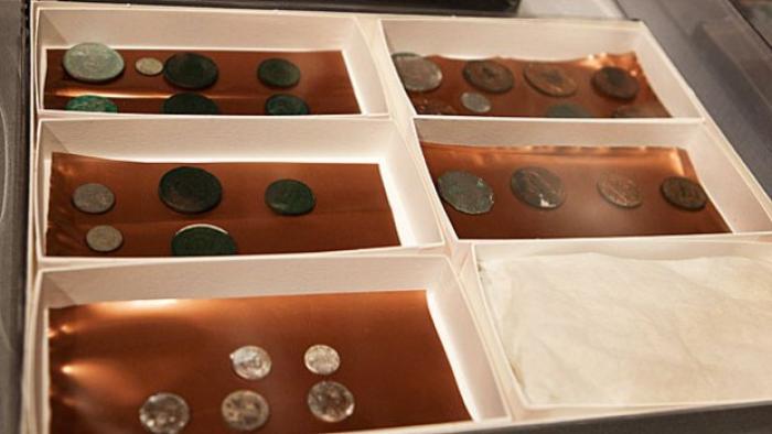 The collection of coins included half-cent, one-cent, half-dime, 10-cent and 25-cent coins, along wi The collection of coins included half-cent, one-cent, half-dime, 10-cent and 25-cent coins, along wi