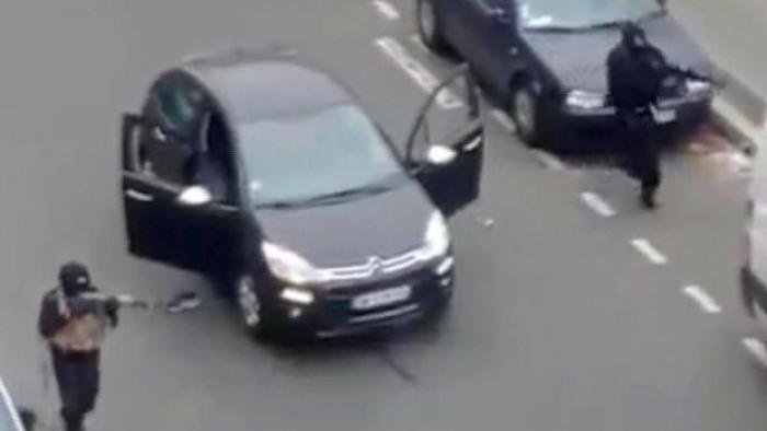 A scene taken by an eyewitness to part of the Paris attack, just moments before a French police offi A scene taken by an eyewitness to part of the Paris attack, just moments before a French police offi