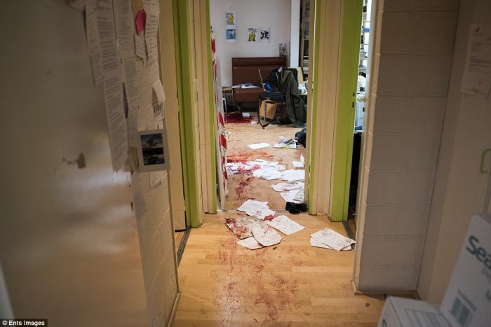 The chilling image from the Charlie Hebdo office shows blood-stained wooden floors, papers strewn ac The chilling image from the Charlie Hebdo office shows blood-stained wooden floors, papers strewn ac